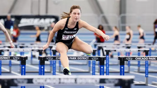 Charlotte Cousins hurdling at the Big East Championships 