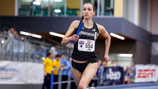 Keira Kelly running relay at 2026 Big East Indoor Track Championships