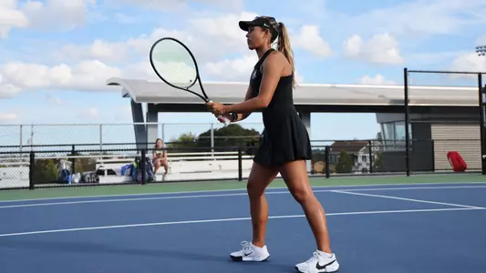 Women's Tennis' Gabriella Plonowski in action against Assumption University