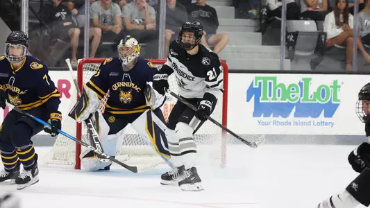 Men's hockey's John Mustard in action against Quinnipiac