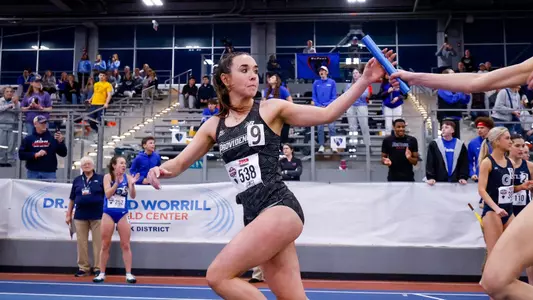 Emily Bush getting handed baton at 2026 Big East Indoor Track Championships