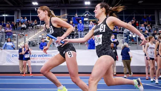 Kate Currie receiving the baton at 2026 Big East Indoor Track Championships