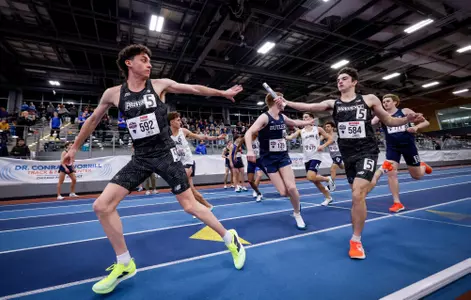 Elliott Pugh receiving the baton during relay at the 2026 Big East Indoor Track Championships