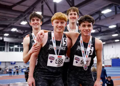 Distance Medley Team of Matt McCabe Oliver Neate Kyle Bloomer and Elliott Pugh pose on the podium with medals at the  2026 Big East Indoor Track Championships