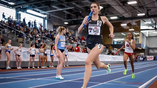 Kiera Hall running the relay at 2026 Big East Indoor Track Championships