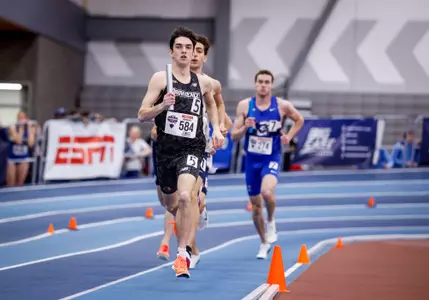 Matt McCabe runs with baton during relay at 2026 Big East Indoor Track Championships