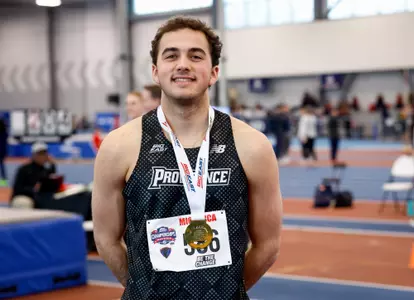 Jon Migancca poses with gold medal after winning the high jump competition at the 2026 Big East Indoor Track Championships