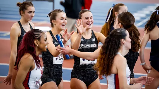  Cara Laverty celebrates with teammates after relay  Big East Indoor Track Championships