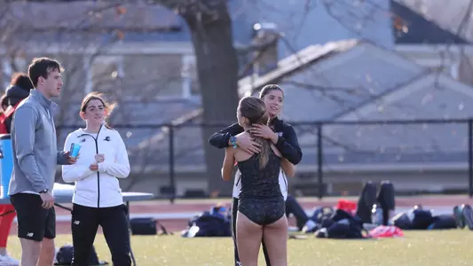 Cate Parks hugging teammates after Friar Invitational race 