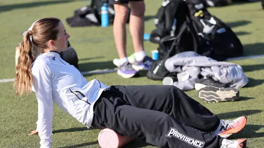 Cate Parks warming up before race at Friar Invitational 