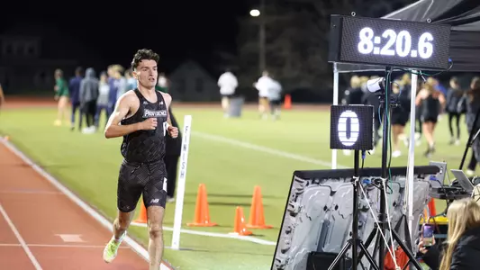 Cormac Dixon winning the 3000 meter race