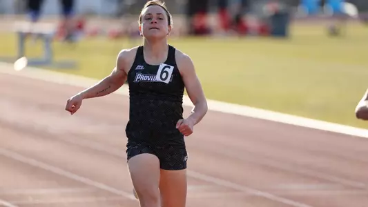 Jenna Jacobs running at Friar Invitational