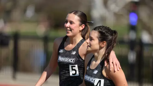 Britton Miller hugging teammate at Friar Invitational