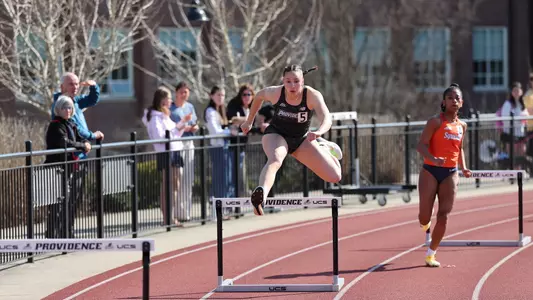 Ella Chanaria hurdling at Friar Invitational 