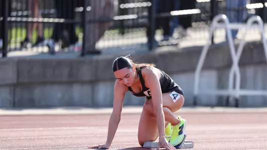 Elena Cabral on start blocks at Friar Invitational 