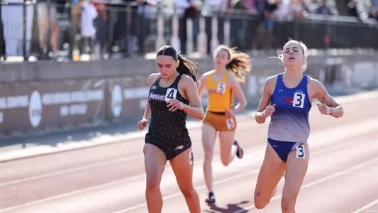 Elena Cabral finishing her race at the Friar invitational  