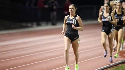 Emily Bush leading the 3000 meter race at Friar Invitational 