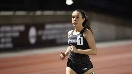 Emily Bush leading the 3000 meter race at Friar Invitational 