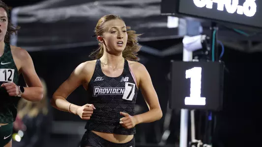 Emilia O'Leary racing the 3000 meter race at Friar Invitational 