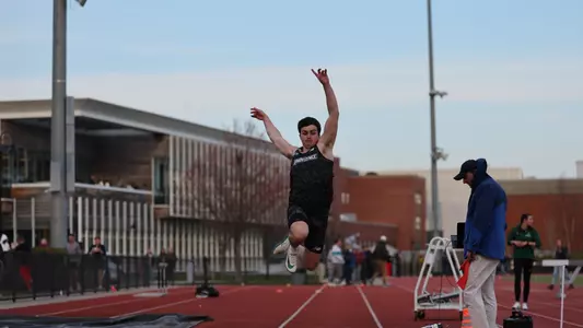 Nik Ventura competing in the long jump at Friar Invitational 