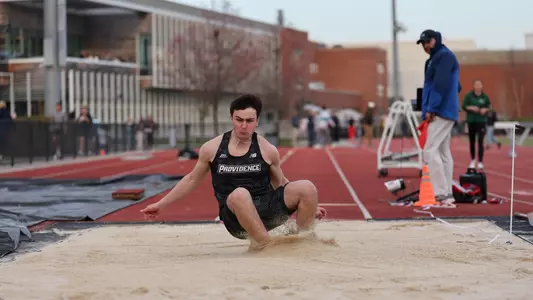 Nik Ventura competing in the long jump at Friar Invitational 