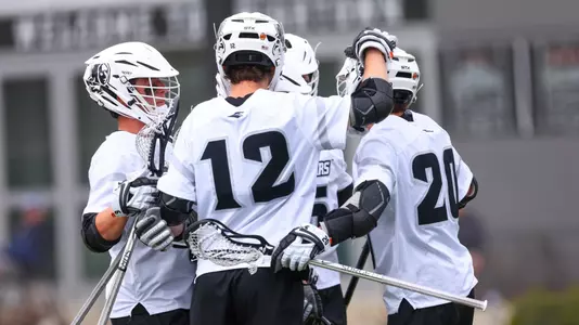 Mens Lacrosse team action photo on chapey field at anderson stadium 