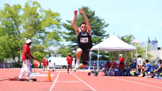 Nik Ventura competing in long jump at Big East Championships 