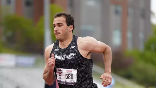 Jon Mignacca running up to high jump at Big East Championship 