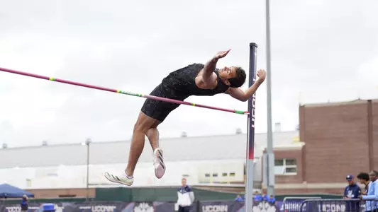 Jon Mignacca competing in high jump at big East championship 