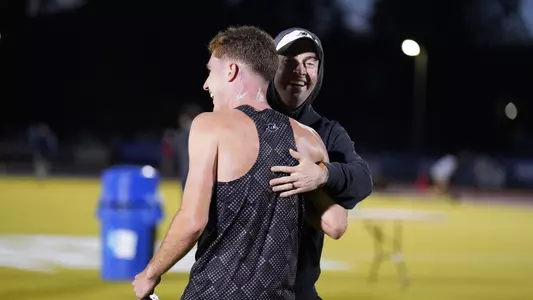 Ryan LoCicero with Coach Brock after winning the 3000 meter steeplechase at the Big East Championship 