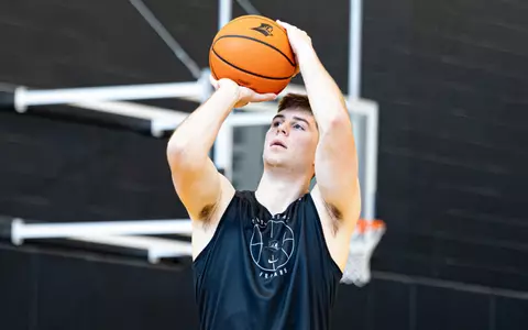 Ryan Mela makes a jump shot during practice 6/16