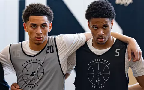 Miles Byrd and Clyde Walters pictured together in a huddle during practice on 6/16.