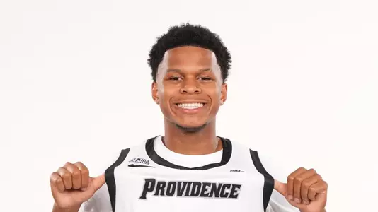 Men's basketball player Gavin Hightower posing for a picture