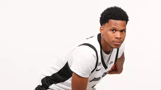 Men's basketball player Gavin Hightower posing during a photoshoot