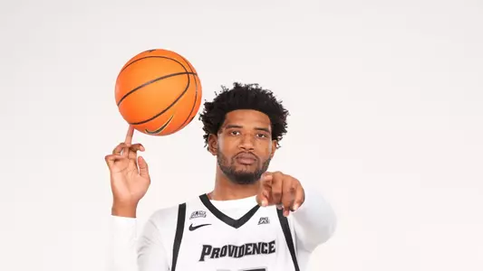Men's basketball player Arrinten Page posing for a photo