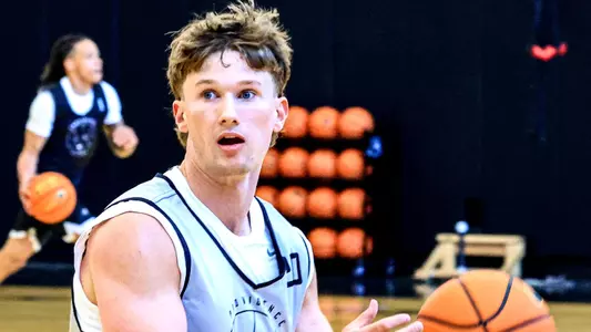 Men's Basketball player Ryan Sabol looking to make an offensive move in practice 