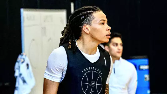 Men's basketball player Malik Mack looks on from the sideline during a practice on June 8th 2026