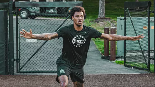 Men's Basketball player Dink Pate warming up for a practice 