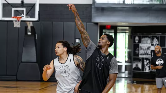 Men's Basketball player Devin Vanterpool Taking a shot during practice 