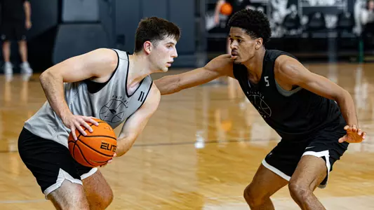 Men's Basketball player Ryan Mela on offense during a practice
