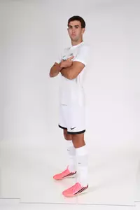 Cameron Yriondo arms crossed posed facing towards the side 