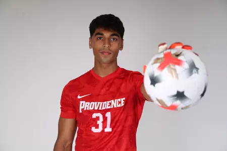 Karan Sobti holding ball in front of camera 