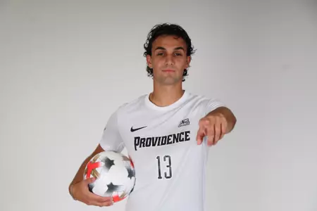 Giuseppe Ciampa ball on hip while pointing at the camera 