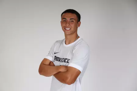 Angelo Ventrella arms crossed facing the side posed 