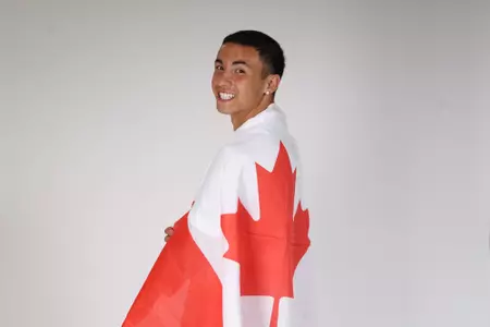 Angelo Ventrella holding a flag turned backward 