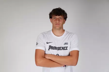 Jeremy Munoz arms crossed facing the camera posed
