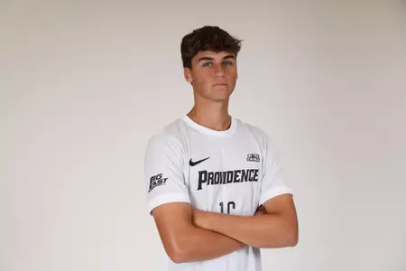 Jack Klein arms crossed facing the side 