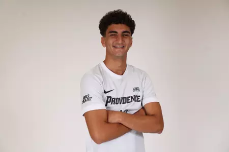Karim Eljamal arms crossed facing the side posed 