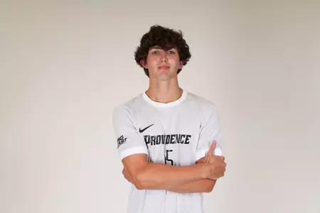 Tommy Tsouros arms crossed facing the camera 
