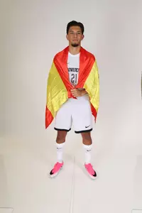 David Casado flag wrapped around him facing forward 